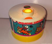Top and side view showing illuminated lens and Dreamtime Carousel graphics
