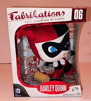 Front view of Harley Quinn Fabrikations plush in original box