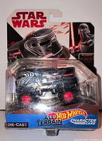 Front view of sealed Hot Wheels Star Wars All Terrain Kylo Ren character car on card
