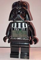Front view of LEGO Darth Vader alarm clock showing LCD time display and overall condition