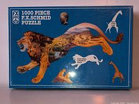 Front of sealed F.X. Schmid 1000-piece lion-themed puzzle box