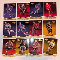 All 12 Immortals hockey cards arranged in three rows of four, fronts visible