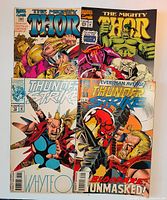 Front covers of four Marvel comic books: two The Mighty Thor, two Thunderstrike