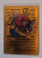 Front view of gold metal Magikarp & Wailord GX card showing artwork, stats, and embossed details