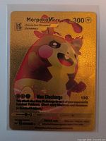Front view of Morpeko VMAX gold foil card in sleeve showing artwork, stats and text