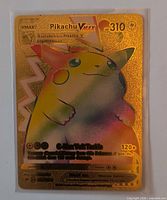 Front view of Pikachu VMAX 310 HP gold foil Pokémon card in sleeve