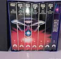 Front view of box showing six visible VHS spines and Generations case