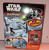 Front of sealed box showing playset artwork and included vehicles