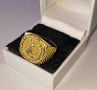 Front view of ring showing Statue of Liberty design and rhinestone border