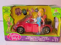 Front of sealed Fashion Polly Convertible playset showing red car, doll and accessories in green box