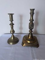 Pair of brass candlesticks, overall view