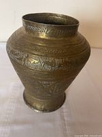 Full view of brass vase showing overall shape and patina