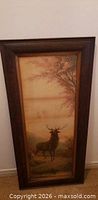 Full view of framed chromolithograph showing stag and landscape