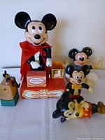 Front view of all five Mickey Mouse items including Magic Show base and figures