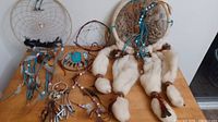 All six dreamcatchers and mandella displayed on table