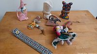 Group view of all folk art pieces on tabletop