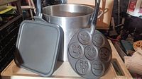 Group shot of stockpot, smiley pancake pan and square griddle