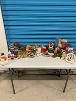 overall lot on table showing variety of Christmas items