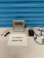 Front view of Memorex MX7300 with adapter and cables