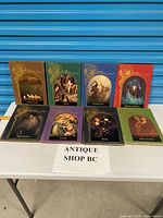 All eight Enchanted World books standing on table