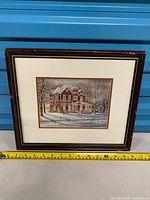 Full view of framed print with measuring tape for scale