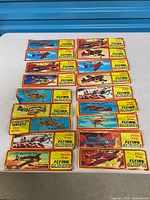 All 24 sealed glider packets laid out on table