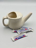 neti pot front view with saline packets