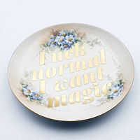 Front view showing full design and text on plate