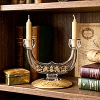 Front view of clear glass Rambler Rose double candlestick holder with two ivory tapers inserted