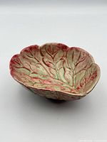Top angle of cabbage-form bowl showing interior glaze and leaf relief