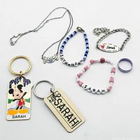 All seven personalized "Sarah" accessories laid out for overview