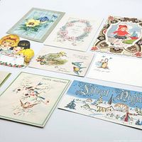 All nine vintage greeting cards arranged, showing fronts and artwork