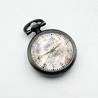 Front view showing dial, hands, crystal condition, gunmetal case