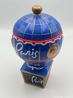 Front view of ceramic Paris Las Vegas balloon jar with lid