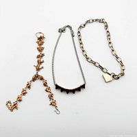All three jewelry pieces laid out