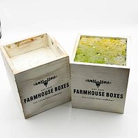 Two whitewashed farmhouse wooden boxes, one with floral foam insert