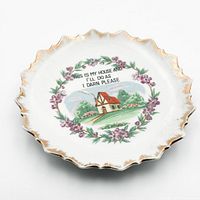 Front view showing full design, gold trim, floral wreath, cottage image, novelty saying