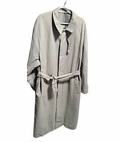 Front view of khaki trench coat hanging with belt tied