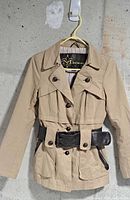 Front view of khaki Mackage coat with belt and buttons