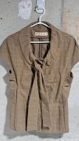Front view of Marni brown plaid cap sleeve top hanging