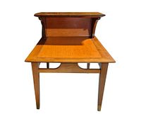 Front view showing two tiers and tapered legs