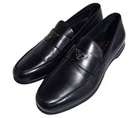 Top view of both loafers showing leather finish and Prada triangle logos