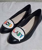 Top view of both flats showing appliqué and interior branding