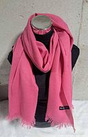 Scarf displayed on mannequin showing color, drape and fringe