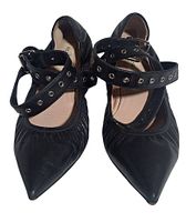 Top view of both flats showing pointed toes and cross straps with eyelets