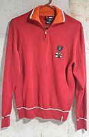 Front view of red Versace Sport quarter-zip sweater showing color, patches and trim