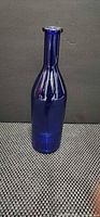 Full front view of cobalt blue glass bottle vase