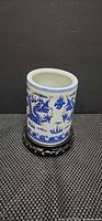 Brush pot on stand front view showing dragon motif