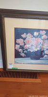 Front view of framed floral art print showing full frame, mat and image