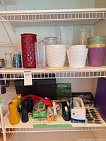 Overall view showing vases, planters and assorted household smalls on shelving